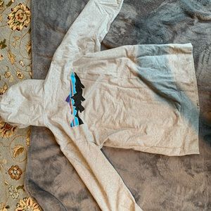 Patagonia zipper hoodie. Men’s size Medium. Grey with fish print on the back.